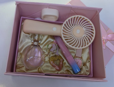 Ladies gift :A perfume,key holder, pin and a portable fan